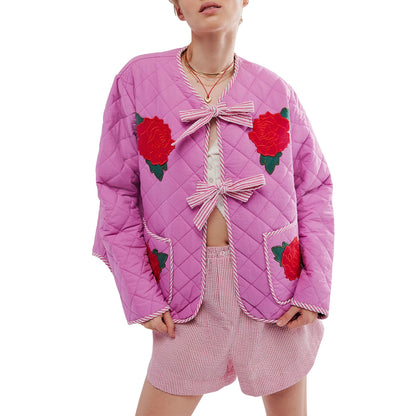 Veste légère rose avec imprimé floral et nœud